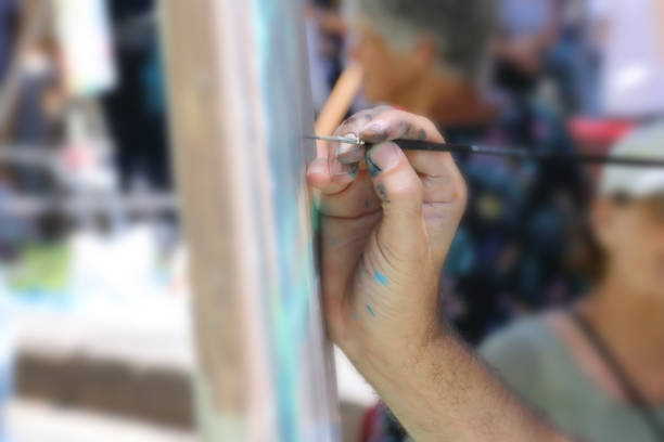istock hand painting with brush 989446684