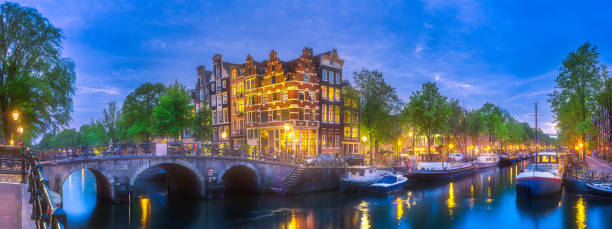 istock Amsterdam city skyline at night, Netherlands 989462796