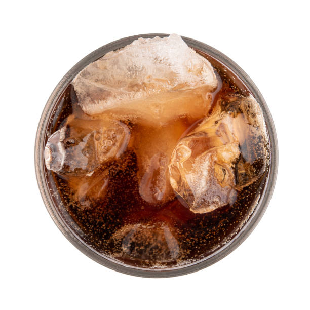 istock Cola in a glass isolated on white background, Top view 989467354