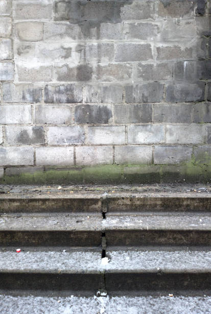 istock Stone wall close-up. Stone wall and stairs. 989467516