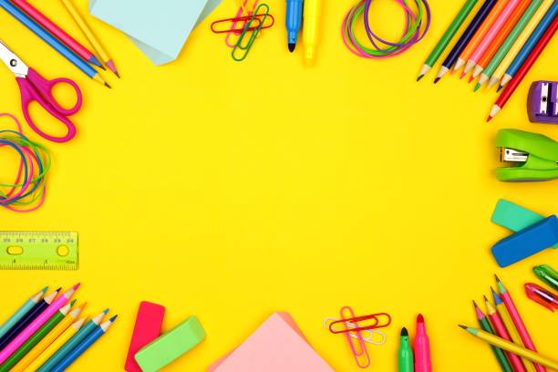 istock School supplies frame over a yellow background 989479896