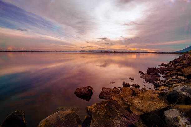 istock land scape sunset at dam in Thailand with full color 989480240