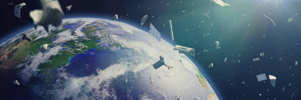 istock space debris in Earth orbit, dangerous junk orbiting around the blue planet (3d illustration banner) 989485500