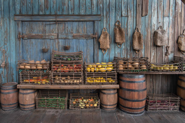 Old, vintage grocery store and marketplace with old, rugged baskets and barrels. Old, vintage grocery store and marketplace with old, rugged baskets and barrels. tomato cages stock pictures, royalty-free photos & images