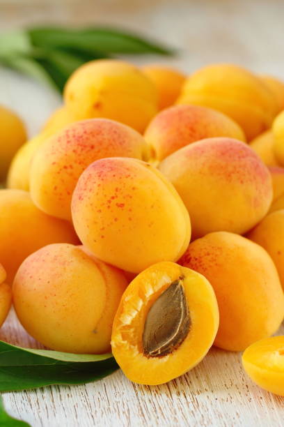 istock Ripe apricots on the table 989518222