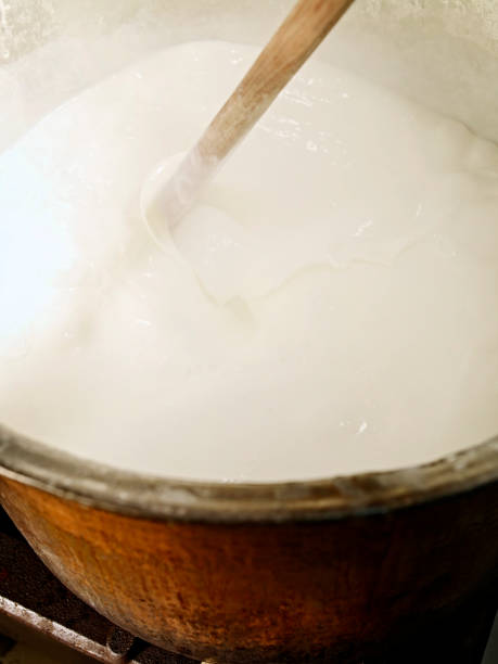 istock mixing large pot of milk 989557512