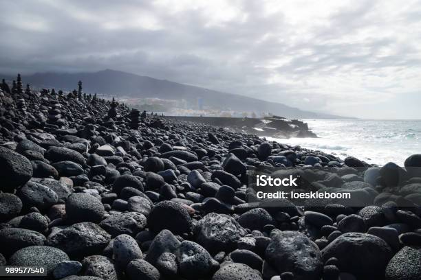 View Over Black Lava Stone Coastline At Puerto De La Cruz Tenerife Canary Islands Spain Stock Photo - Download Image Now