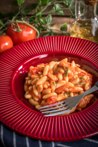 istock Cavatelli pasta with fresh tomato sauce. 989610534