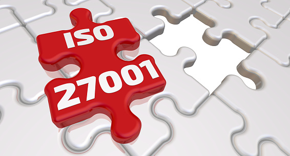 Folded white puzzles elements and one red with text: ISO 27001 (information security standard). 3D Illustration
