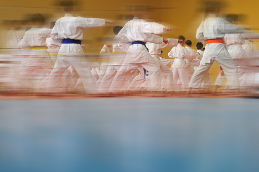Motion blur Blurred Background. Children's training on karate.