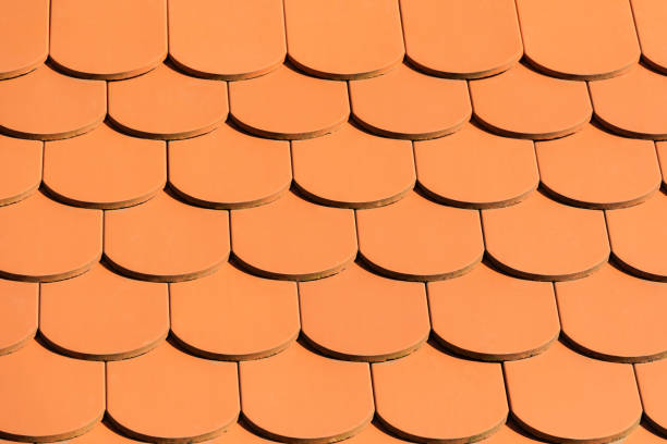 istock Red roof texture. Close up tile roof. Abstract background 989625420