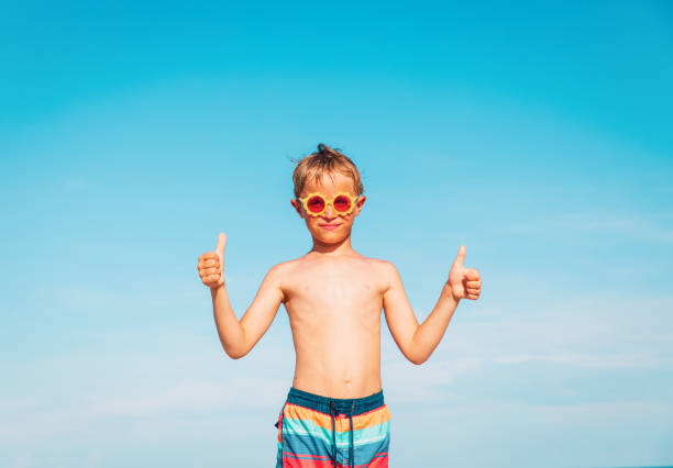 istock happy little boy enjoy tropical beach 989640772