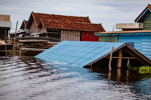 Tonle Sap lake is a town floating on a lake, but was severely flooded in 2011, here showing rooftops nearly under water