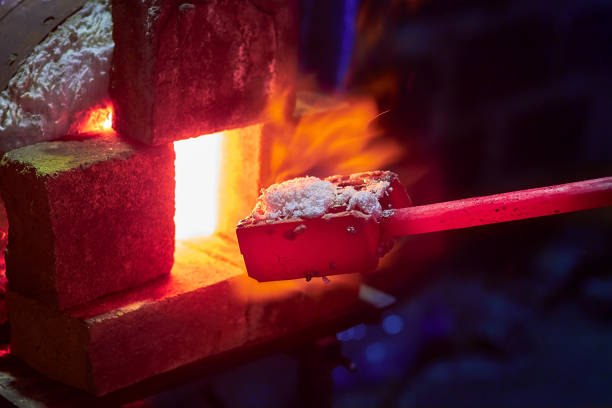 istock Burning  in a blacksmith forge.  Making metal items in smithy. In the smithy a red-hot iron piece in a hot fire flame is ready for further processing 989666804