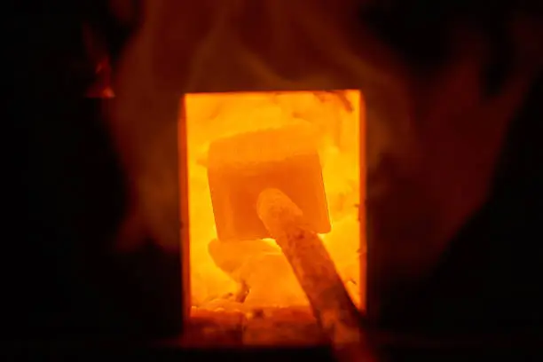 Fire in the furnace in the smithy, tools. Concept: blacksmithing, forge