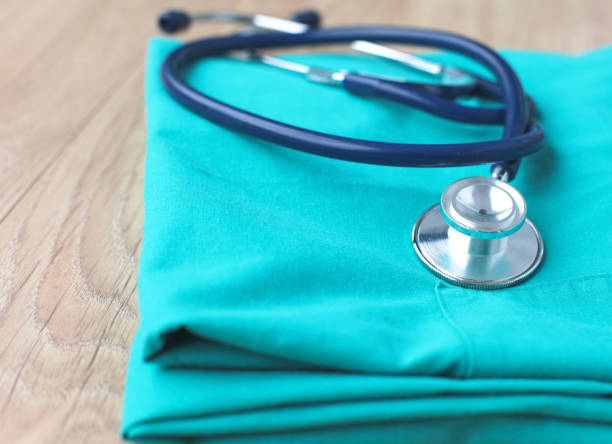 istock A stethoscope shaping a heart on a medical uniform, closeup, selective focus 989669718