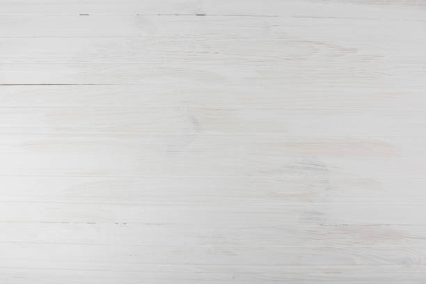 istock Empty White Painted Wood Background High Contrast Bright Light Top Angle View 989670084