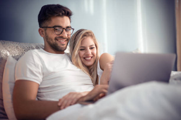 istock Happy young couple enjoying at home 989685420