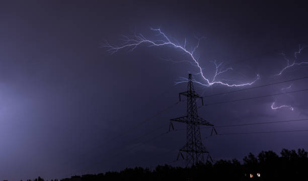 istock Lightning strike charge on the dark sky at power line electricity 989708634