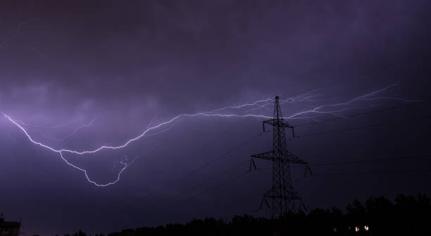 Lightning strike charge on the dark sky at power line electricity Lightning strike charge on the dark sky at power line electricity lightning tower stock pictures, royalty-free photos & images