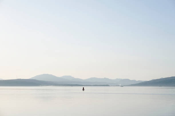 istock Tranquil sunset river Clyde peaceful view mountains summer inverclyde evening gourock greenock Scotland uk 989709140