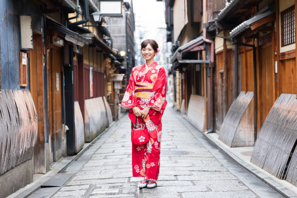 attractive asian woman wearing kimono in autumn attractive asian woman wearing kimono in autumn kimono stock pictures, royalty-free photos & images