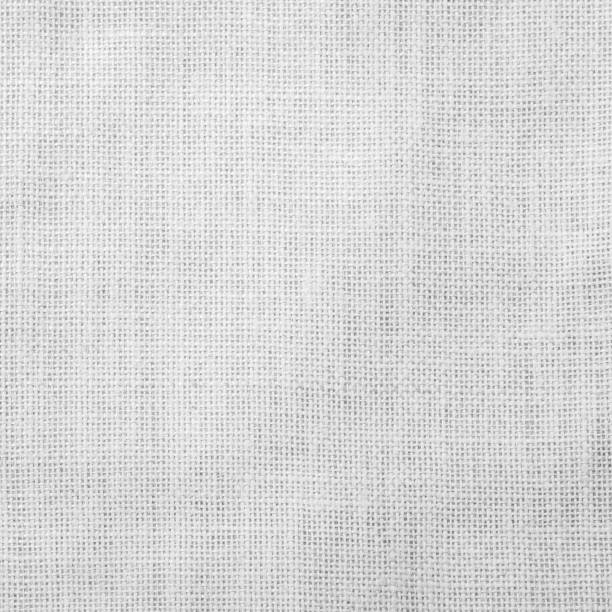 istock Hessian sackcloth woven fabric texture background light white grey color 989794770