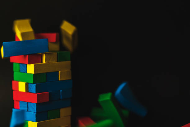 creativity ideas concept with colorful wooden block stack on black background