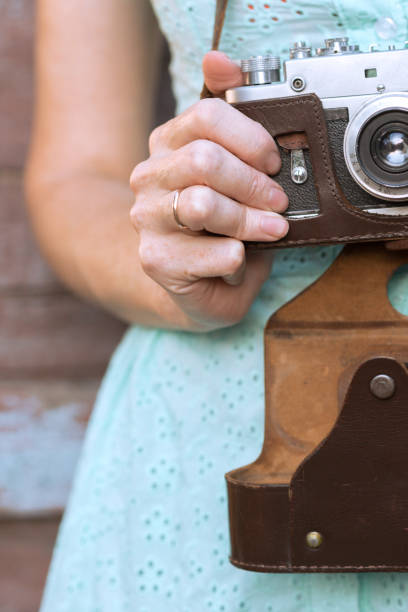 istock Girl with retro camera. Vintage 989800110