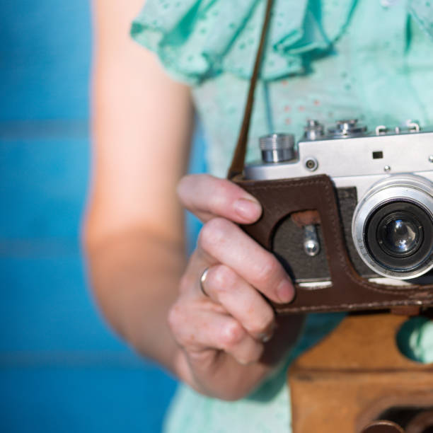 istock Girl with retro camera. Vintage 989800134