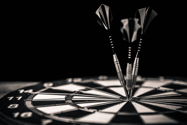 istock darts arrows in the target center business ideas concept isolate black background 989800136