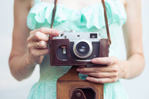 istock Girl with retro camera. Vintage 989800194
