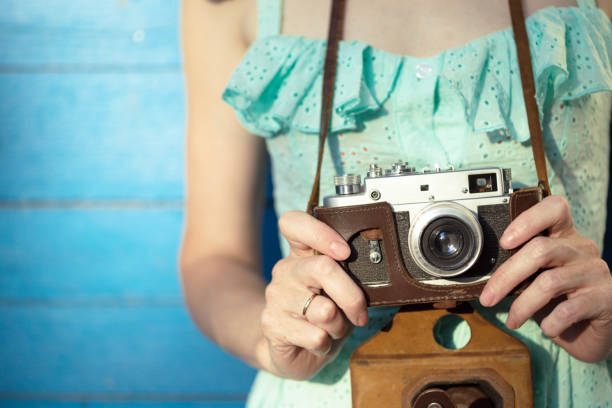 istock Girl with retro camera. Vintage 989800216
