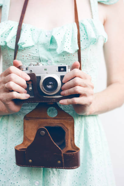 istock Girl with retro camera. Vintage 989800362