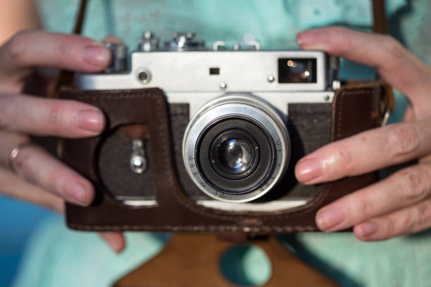 istock Girl with retro camera. Vintage 989800398