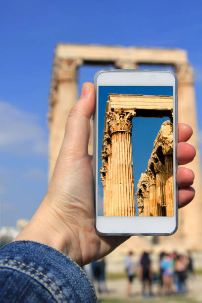Tourist snapshot of the Temple of Olympian Zeus, Athens, Greece Travel concept - tourist snapshot of the Temple of Olympian Zeus, Athens, Greece. olympeion stock pictures, royalty-free photos & images