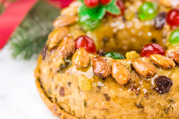 istock Delicious glazed colorful Christmas fruitcake 989840314