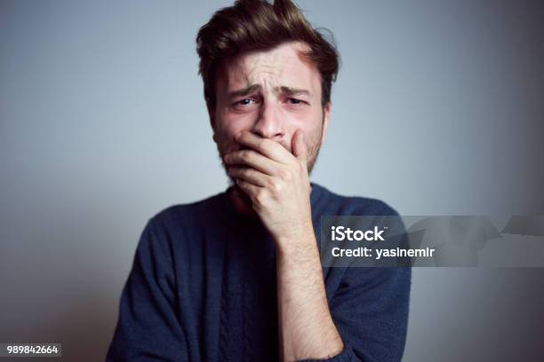 Young Sleepy Frustrated Male Teenager Yawning Alone In The Studio Real People Emotions Tiredness Exhausted Stock Photo - Download Image Now