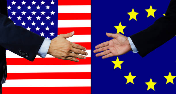 istock A business man shake each other hand, USA and EU 989848060