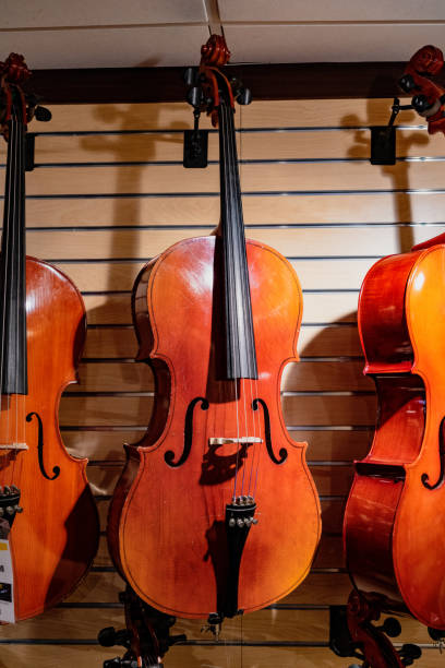 istock Cellos for sale in store 989937060