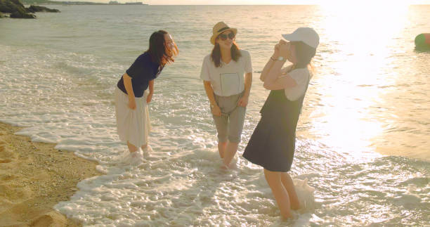Young female walking on the beach.