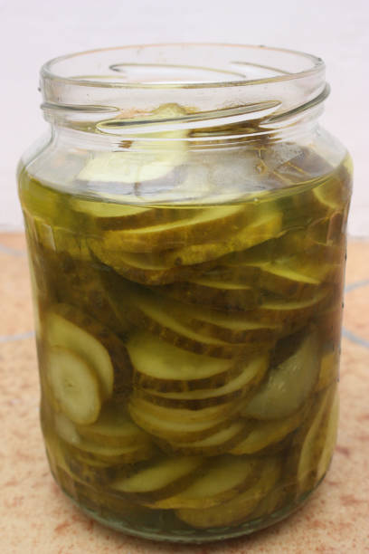 istock Large pickles in slices  Canned in glass jar 989961916