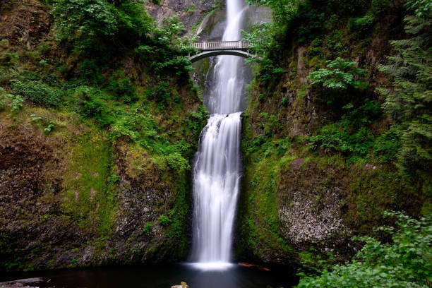 istock Bridge over waterfall - Multnomah Falls in Oregon. 989992900