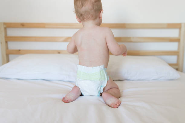 istock Babie wearing diapers 11 month 989995932