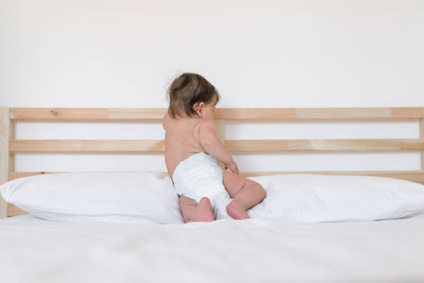 istock Babie wearing diapers 8 month 989998082