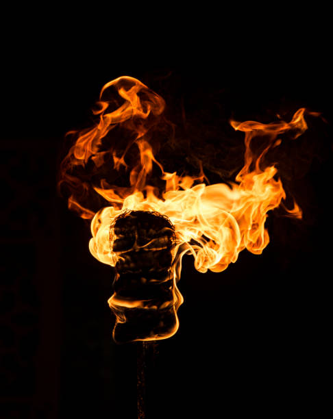 istock Fire from oil soaked cloth on stick 990009690