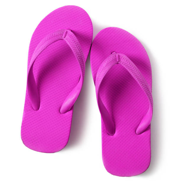 istock Vivid pink flipflops beach sandals isolated on white background 990019682