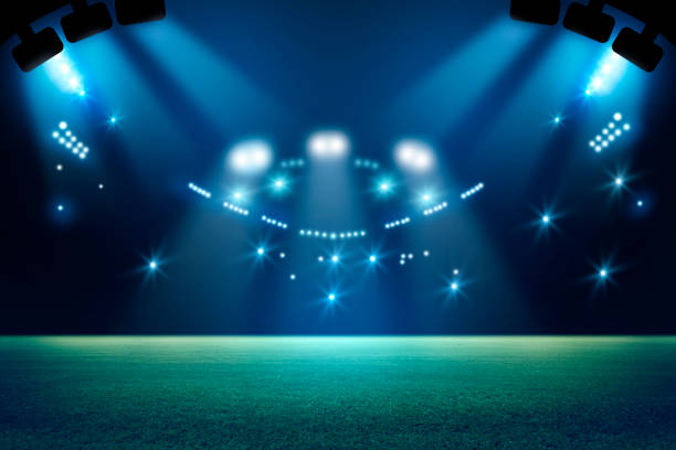 istock stadium in lights and flashes 3d. Mixed photos 990033134