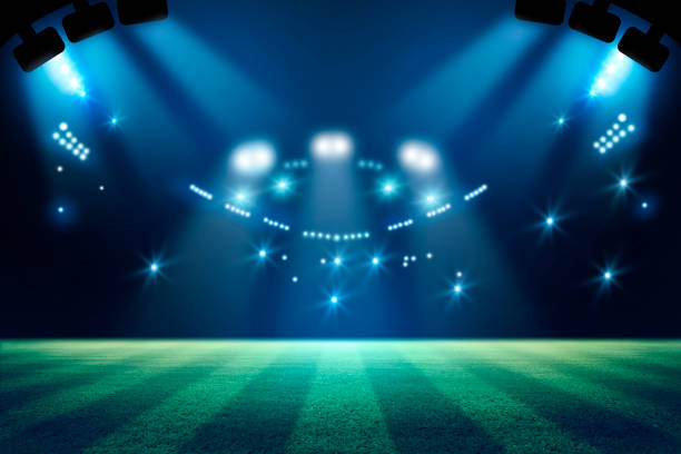 istock llights at night and football stadium 3d rendering. Mixed photos 990033146