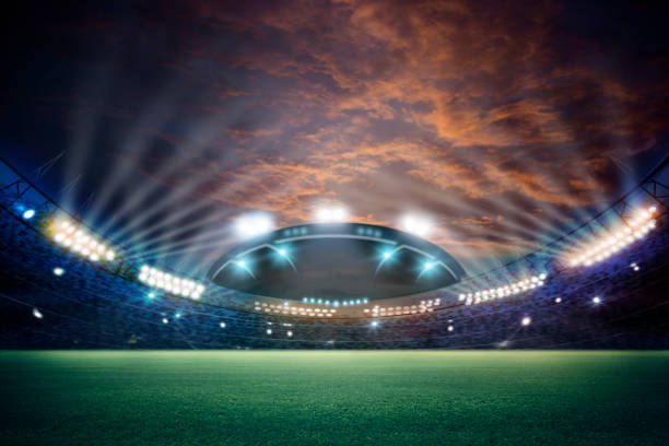 istock stadium in lights and flashes 3d. Mixed photos 990033162